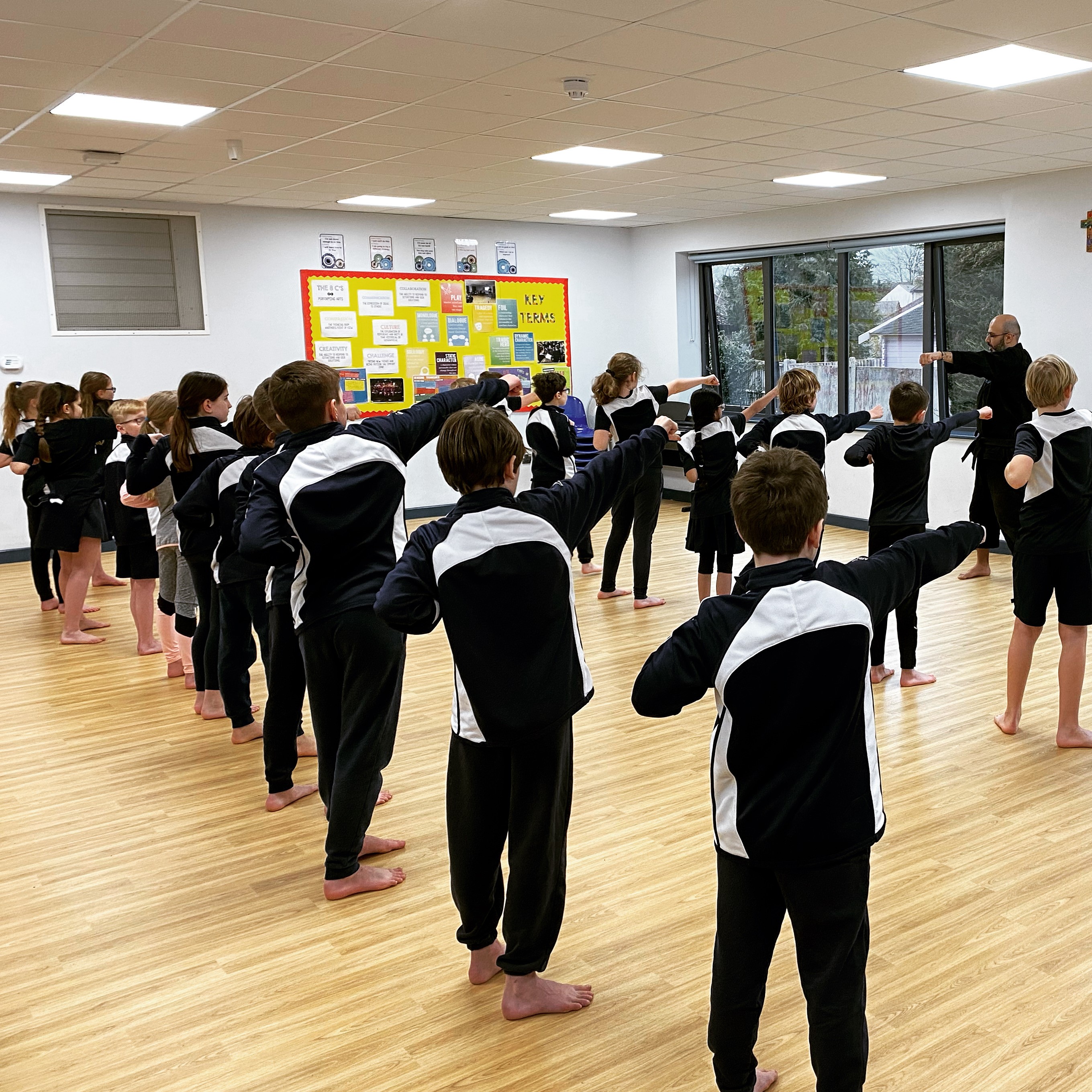 Children practising martial arts technique in an after-school class at Shuhari Self Defence Windsor